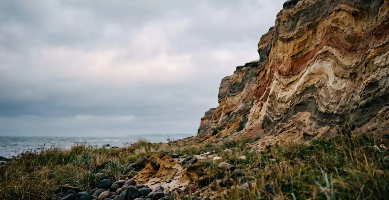 Dramatic coastal clay cliffs of Bornholm island with natural sedimentary layers